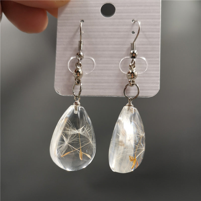 Wholesale  selling resin drop glue dandelion dried flower earrings and the United States dried flower earrings manufacturers